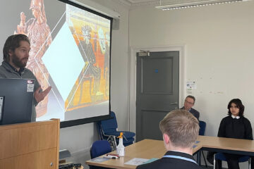 School pupils listening to presentations in the School of Classics